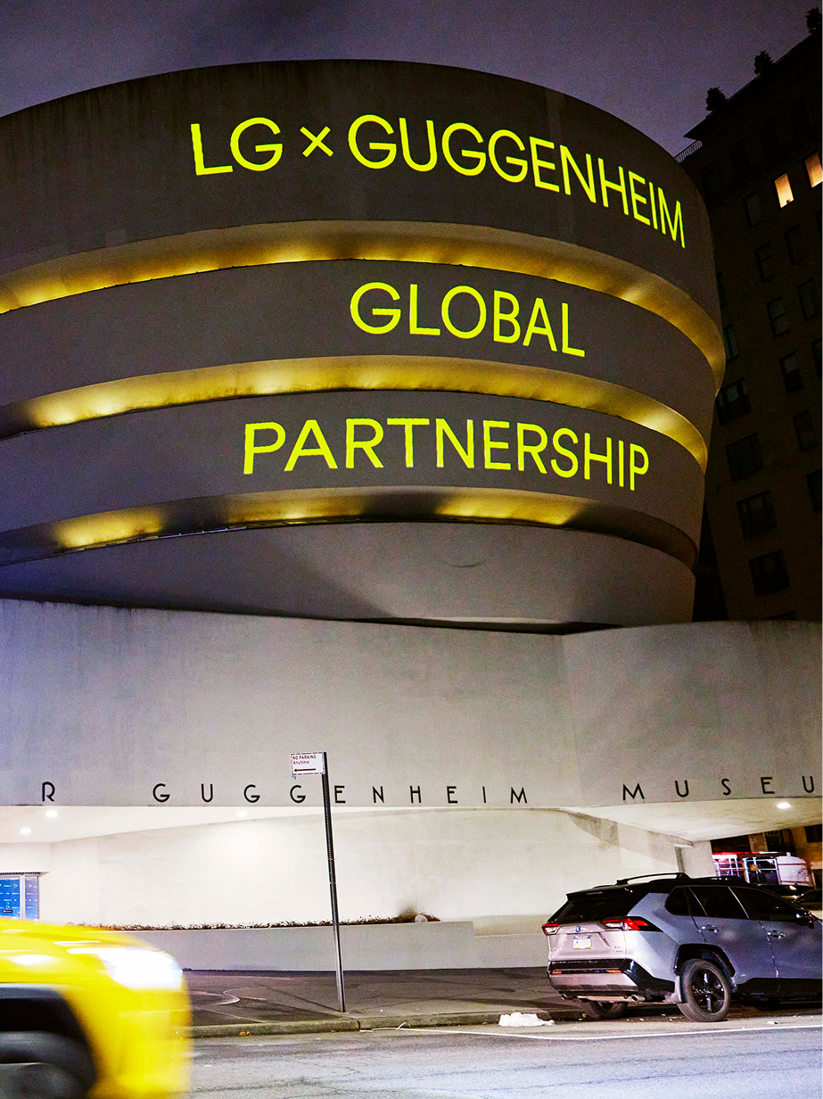 LG Guggenheim Art and Technology Initiative branding projected on the facade of the Guggenheim Museum in New York