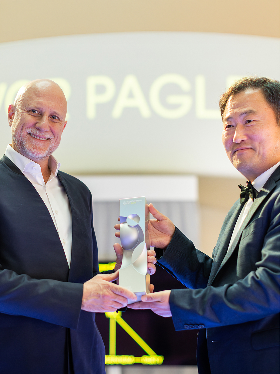 Trevor Paglen receiving the LG Guggenheim Award trophy and congratulations