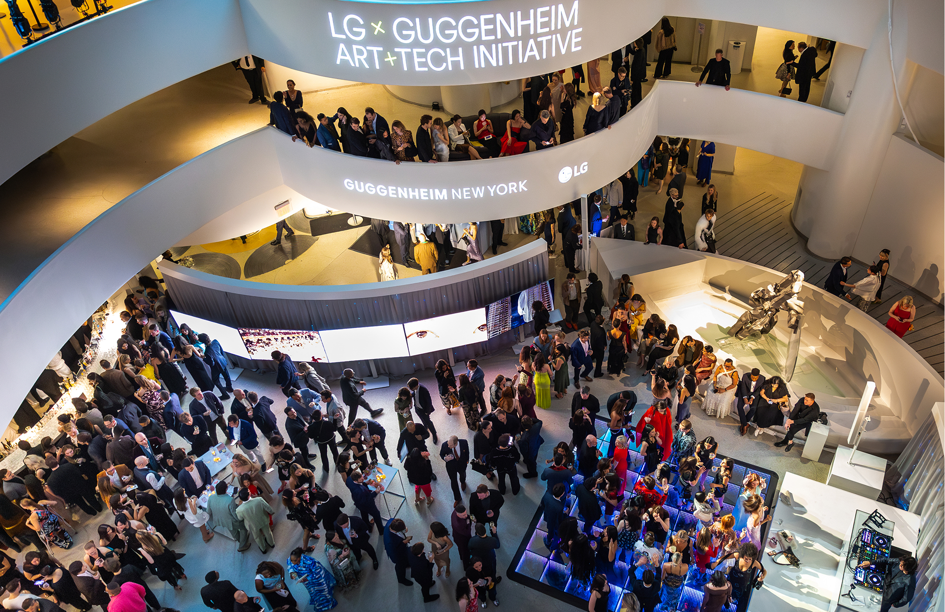 LG branding and LG OLED TV illuminating the Guggenheim Museum rotunda